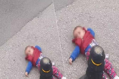 Ana 7 aylıq körpəsini yolun ortasına atdı